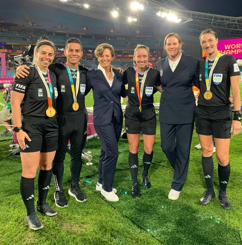 After the 2023 Women’s World Cup final. From left: Brooke Mayo, assistant referee, Armando Villarreal, assistant video assistant referee (AVAR), Kari Seitz, FIFA referee manager-women’s, Tori Penso, referee, Cindy Parlow Cone, U.S. Soccer president, and Kathryn Nesbitt, assistant referee 2. 