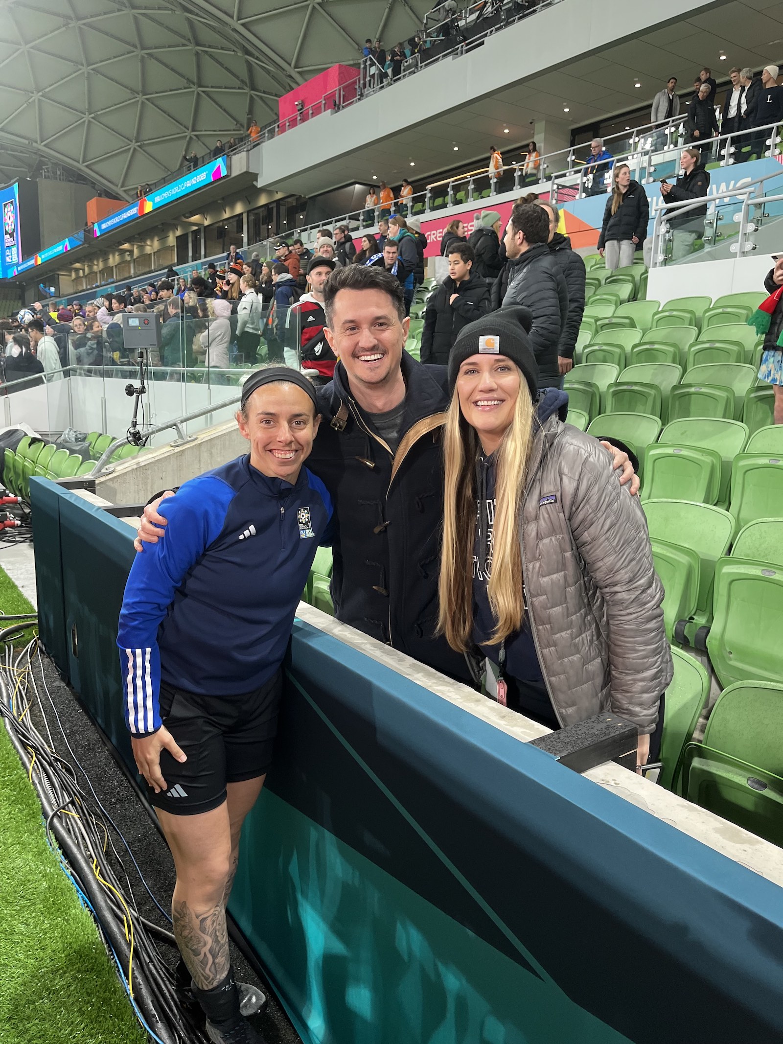 From left: Brooke Mayo, former Tech tennis player Yianni Doropoulos, and Mayo’s partner Falon Catalano are pictured after Mayo officiated her first World Cup match, Germany vs. Morocco, in Melbourne, Australia. 