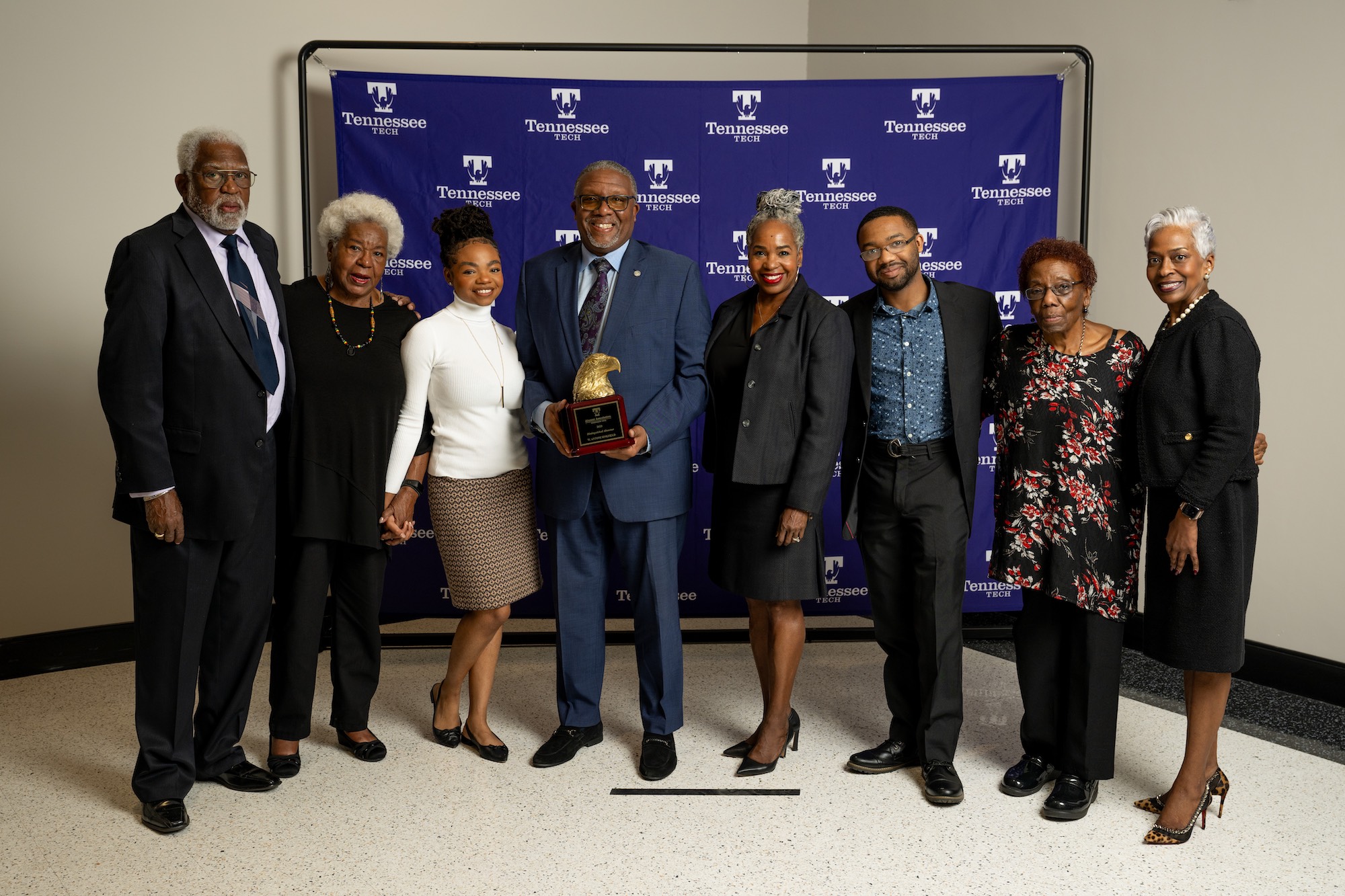 Rev. Dr. W. Antoni Sinkfield (center) and his wife, Kristy (fourth from right) are pictured alongside family and friends at Tennessee Tech’s “Evening of Excellence” alumni awards banquet on Nov. 4, 2023. 
