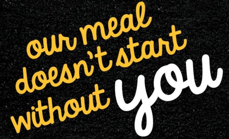 black text box with cursive. font thst says 'our meal doesn't start without you'