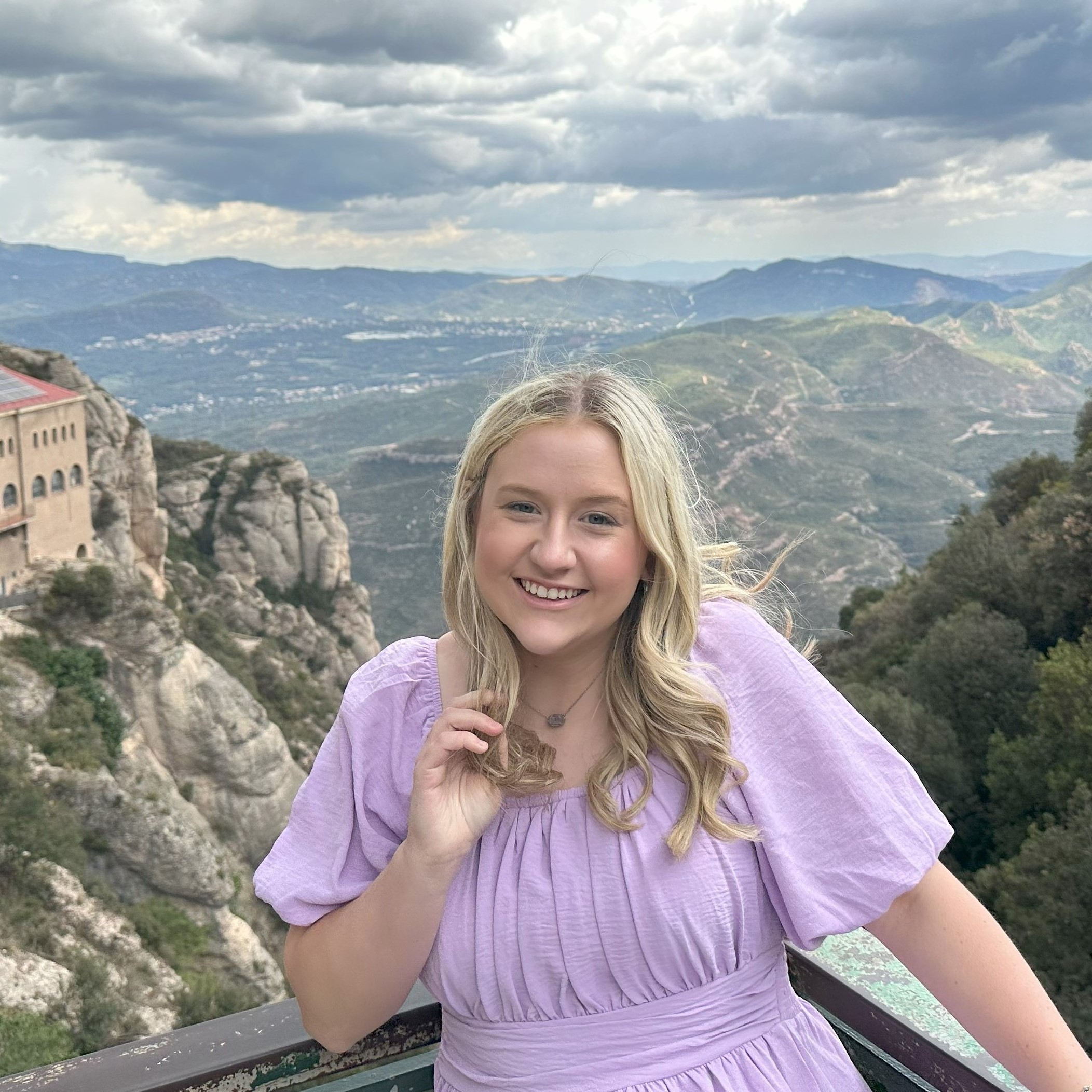 Addison Dorris abroad with a skyline behind her.