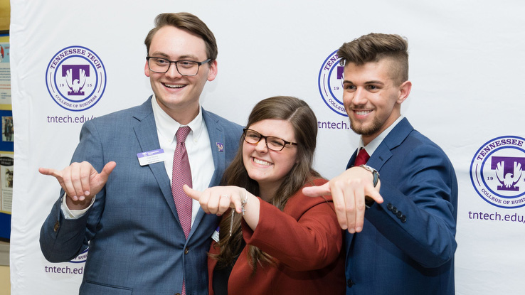 Students give wings up symbol
