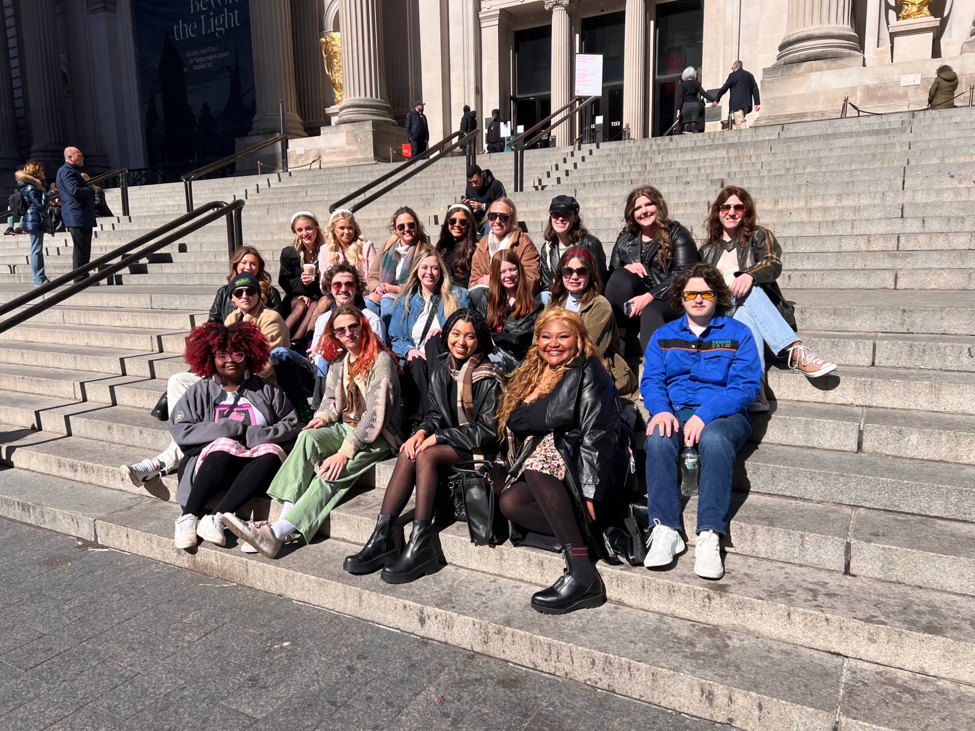 Sitting on the steps of The Metropolitan Museum of Art before our self-guided tour of centuries of art and design history