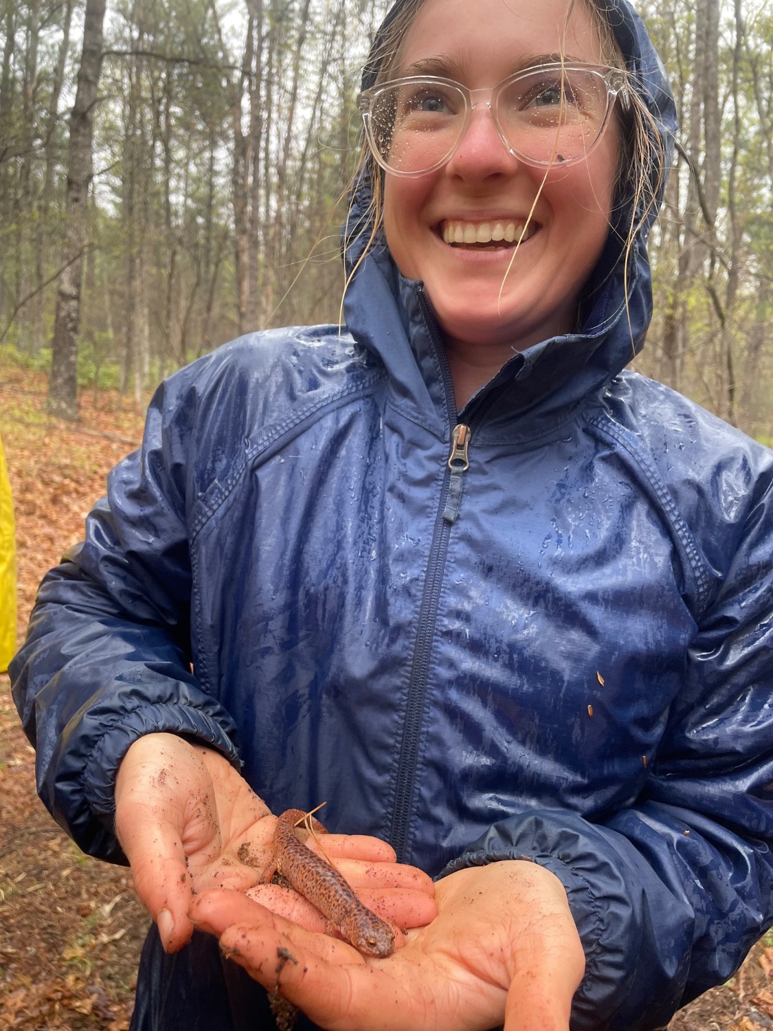 Jenna Morris smiling holding salamander