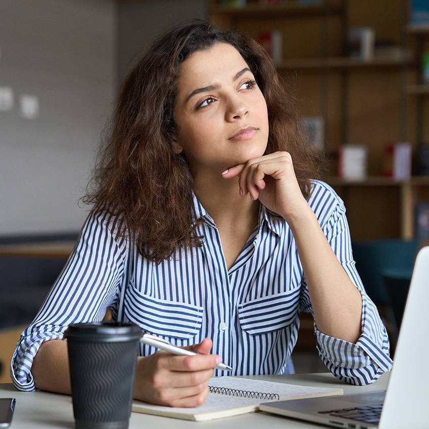 person sitting with computer thinking person sitting with computer thinking