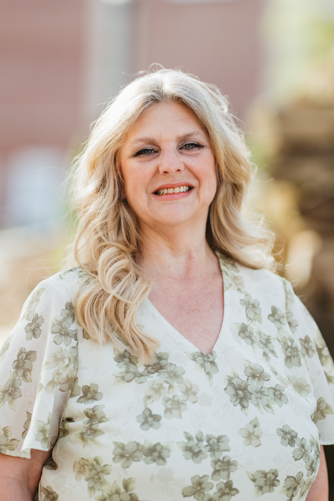 Female blond Caucasian in a dress. 