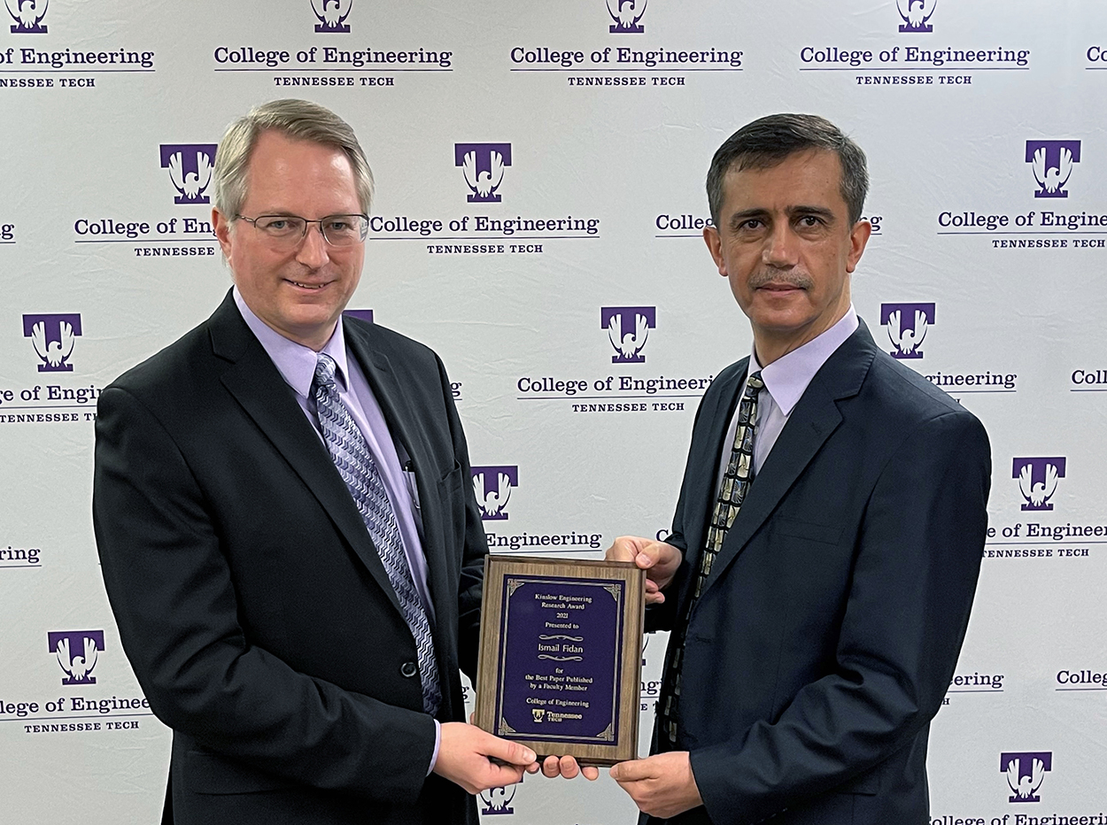 College of Engineering Dean Joseph C Slater presents the Kinslow Award for 2021 plaque to Ismail Fidan for 2021
