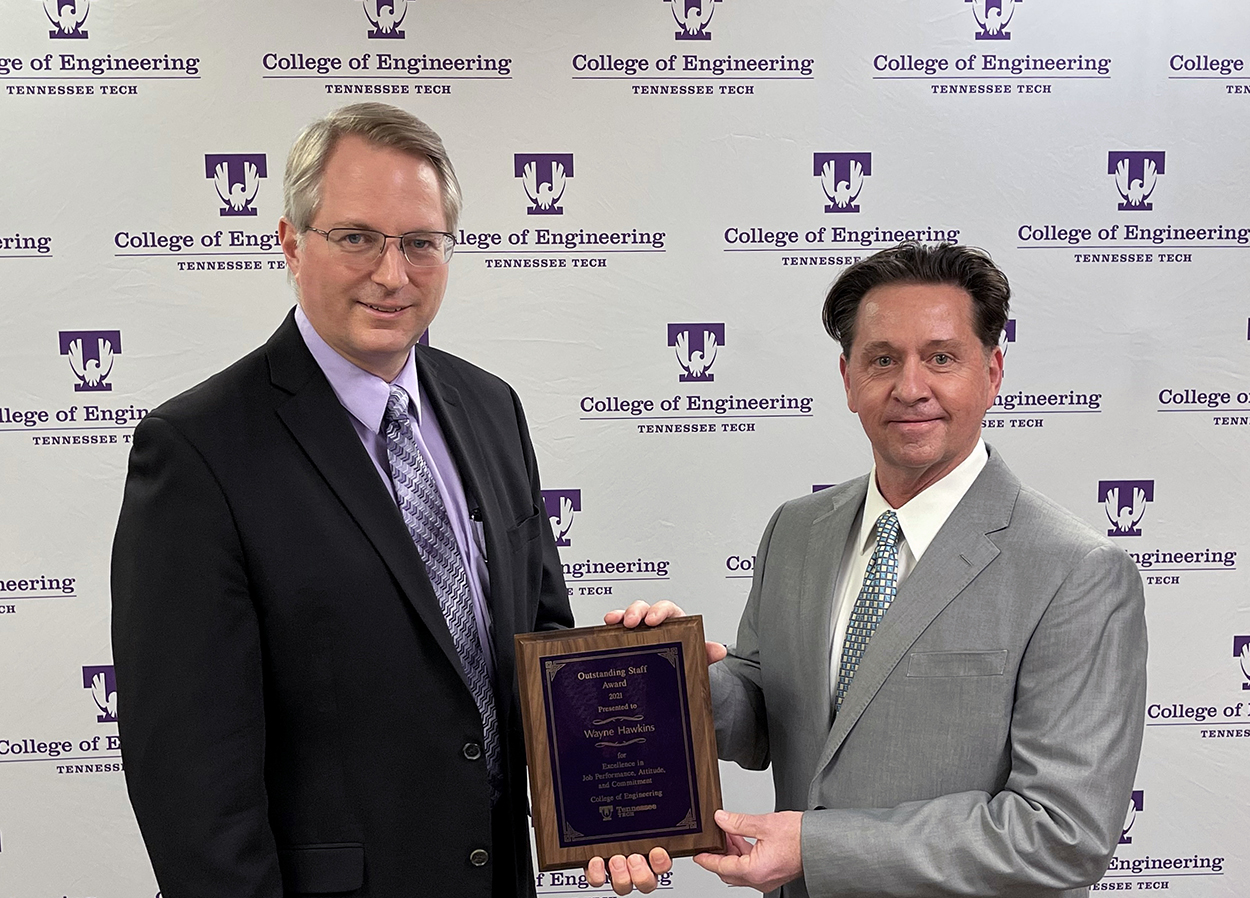College of Engineering Dean Joseph C Slater presents the Outstanding Staff Award for 2021 plaque to Wayne Hawkins for 2021
