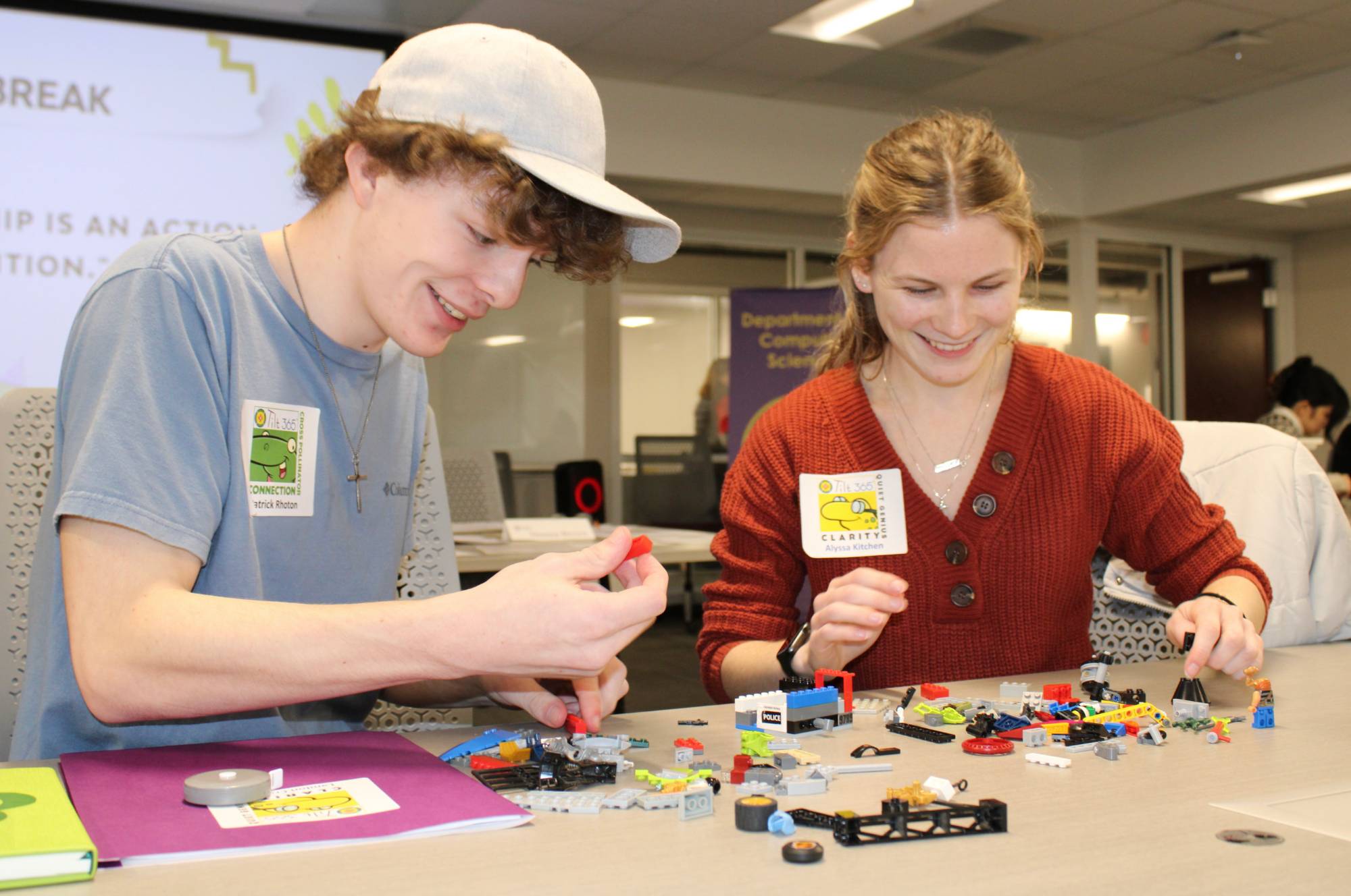 Two students working on legos