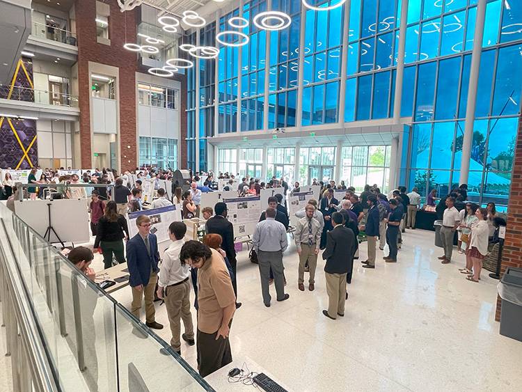 Students presenting projects at the expo