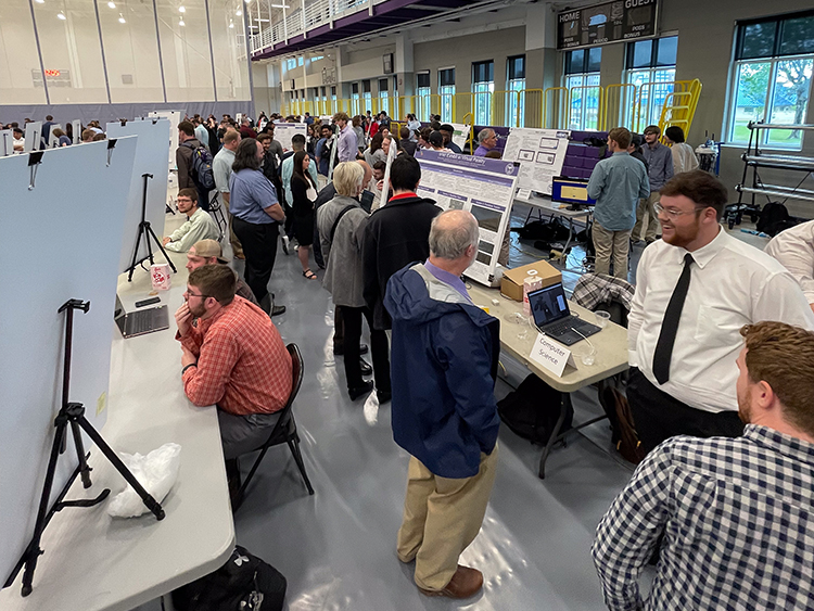 Students presenting projects at the expo