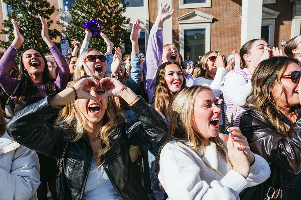 Students reacting to the homecoming parade.