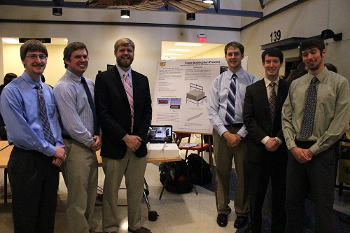 Students standing with their project