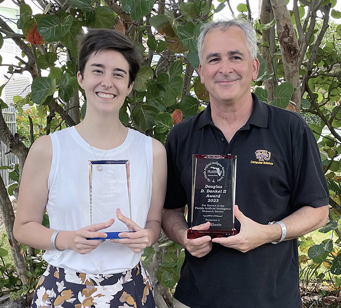Katie Brown and Bill Eberle with FLAIRS awards