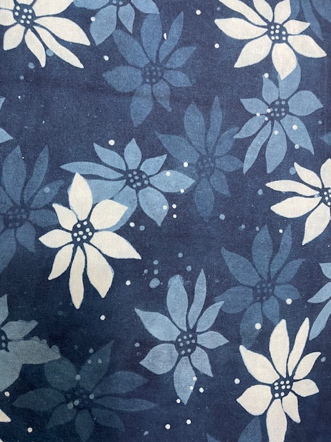 Close up of blue shibori scarf with flower design