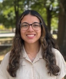 Tania Flores by tree