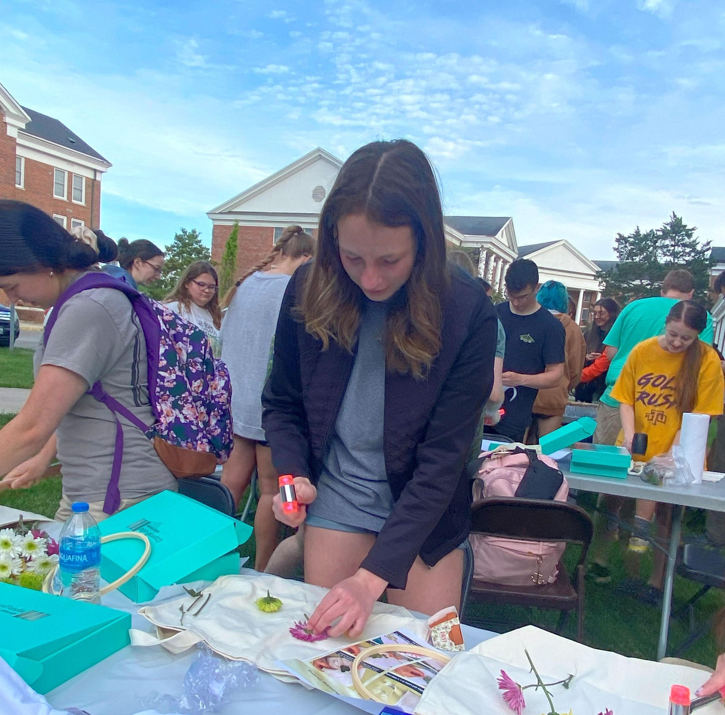 honors students using plants to print images on tote bags