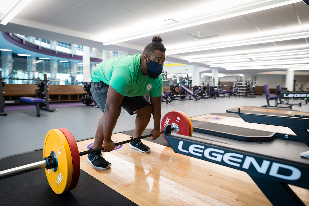 Tennessee Tech student Josh Gordon lifts weights in the new Marc L. Burnett Fitness and Recreation Center. The new weight room has more than 13,000 square feet of space.