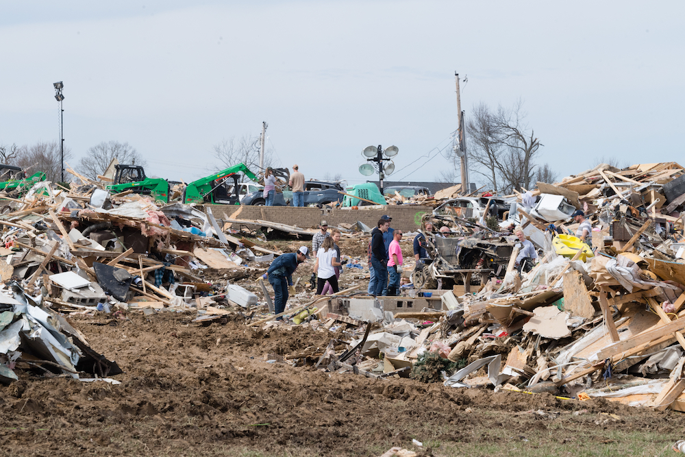 Tennessee Tech students search through the rubble on Wednesday after an F-4 tornado ripped through Putnam County on Tuesday.