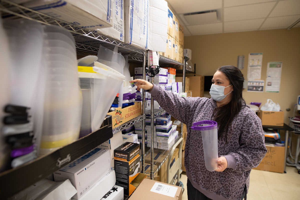 Jada Woolbright of Tennessee Tech Health Services stocks the supply closet.