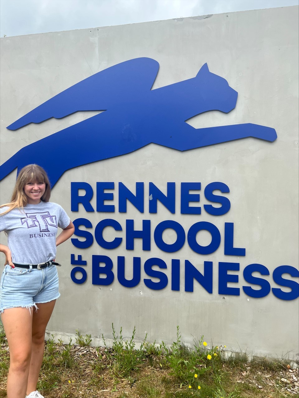 Faith Judkins stands with a TTU shirt on in Rennes, France