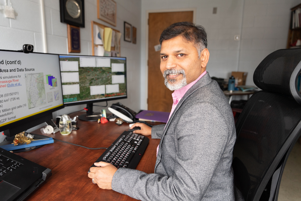 Alfred Kalyanapu, associate professor of civil and environmental engineering, at his computer.