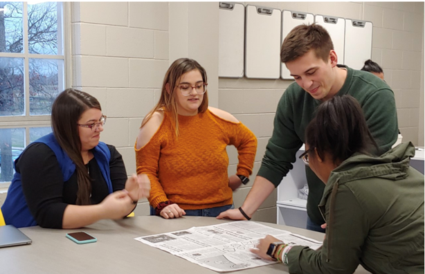 From left, Sabrina Bauer, Angelica Lance, Jake Ramaker and Kellie Malone work on a grant-related project.