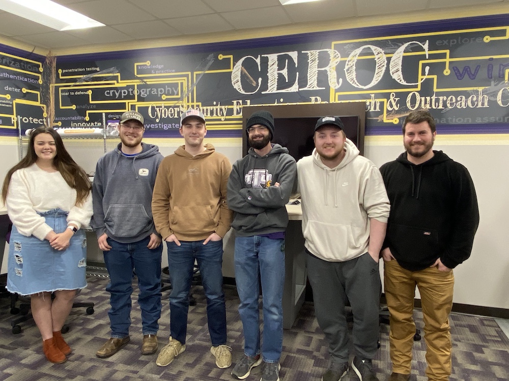 Cybersecurity Team members, from left, are Kaitlyn Carroll, Jesse Holland, Austin Brown, Jacob Sweeten, Austin Tice and Coach Travis Lee. Not pictured is team member John Housley.