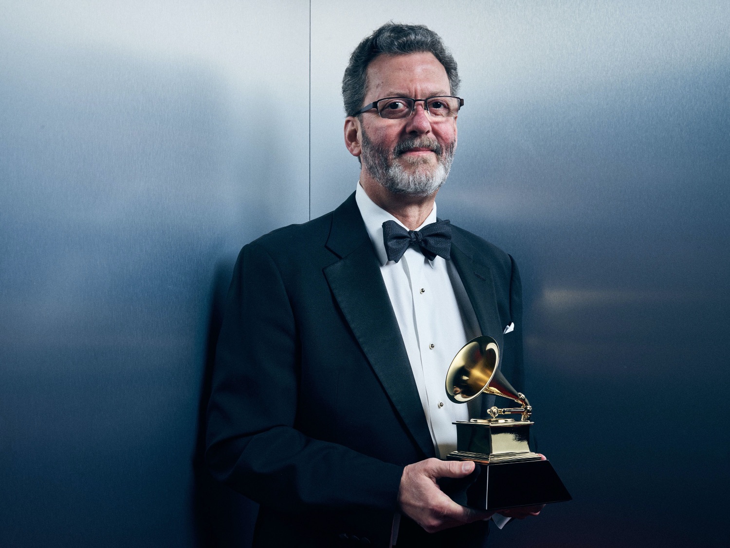 Alspaugh holds one of his previously won Grammys.