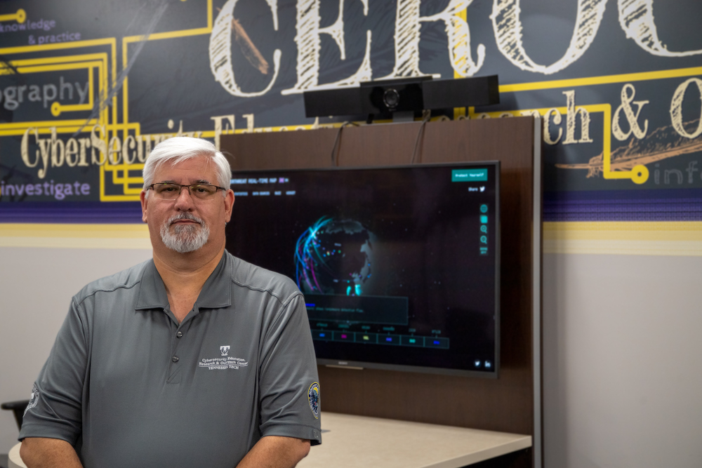 Eric Brown stands in Tech's Cybersecurity Education Research and Outreach Center