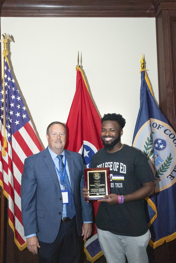 Cookeville Police Chief Randy Evans presents Tech student Jamaal Thompson with the Distinguished Citizen Award.