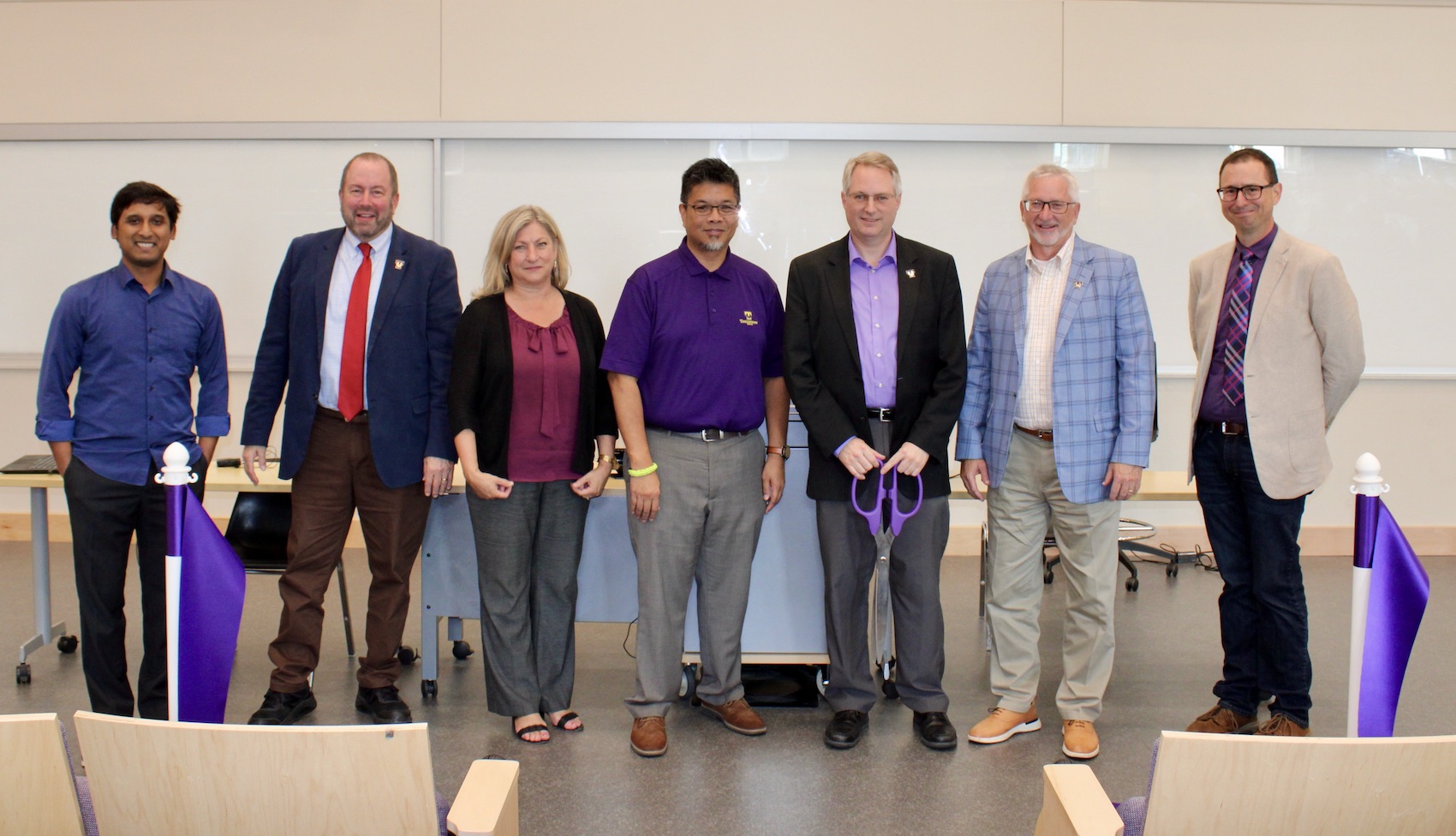 Cutting the ribbon for the opening of Tennessee Tech’s Science DMZ research network are, from left, Susmit Shannigrahi, assistant professor of computer science; Carl Pinkert, interim vice president for research; Lori Mann-Bruce, provost; Gerald Gannod, chair of the computer science department; Joseph C. Slater, dean of the College of Engineering; Philip Oldham, president of Tennessee Tech; and David Hales, information technology services assistant director for network operations.
