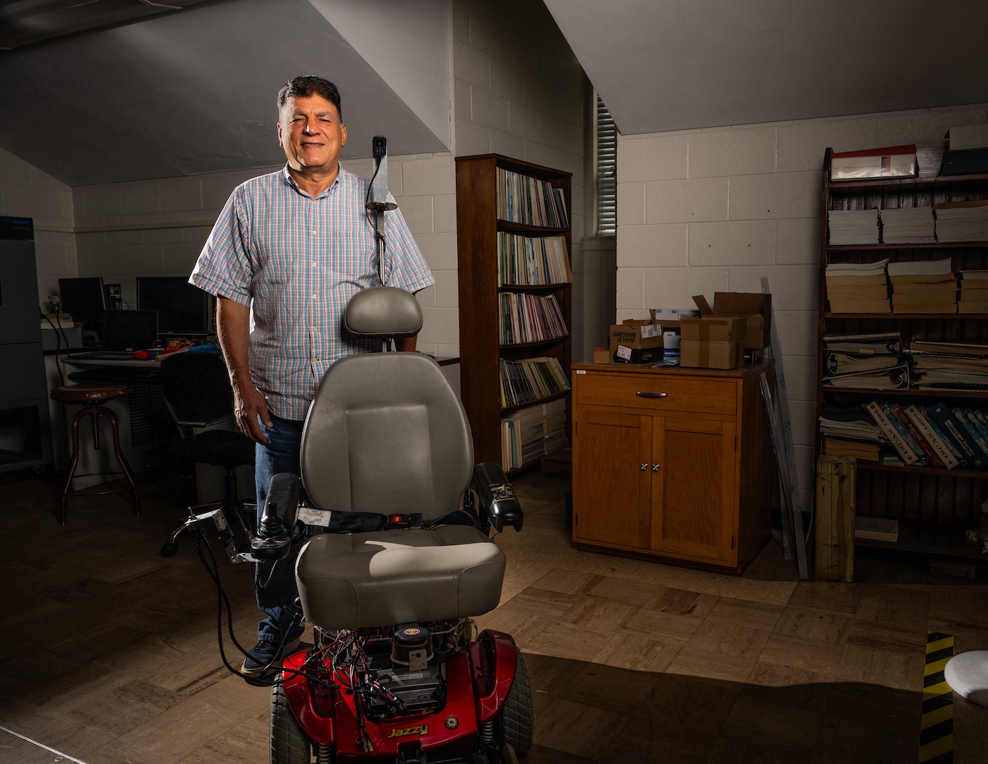 Professor Ali Alouani pictured with Brady's autonomous wheelchair prototype.