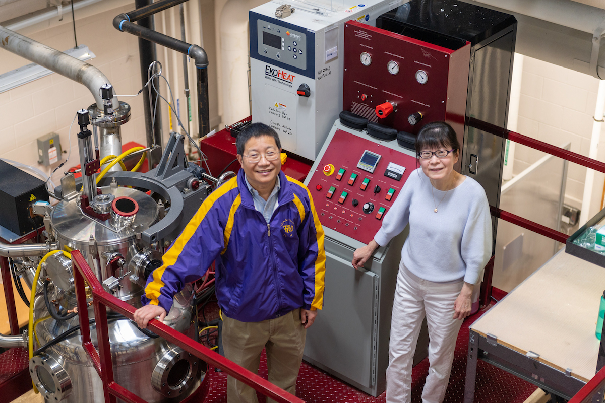 Tech’s husband and wife duo of Jiahong Zhu (left) and Ying Zhang (right) pictured in front of the VersaMelt gas atomizer used as part of their clean energy research. It is the only equipment of its kind in the state of Tennessee. 