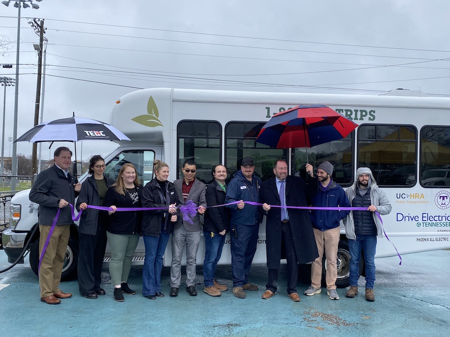 Tech faculty and students are pictured with community leaders at the ribbon cutting for the region’s first electric shuttle vehicle. 