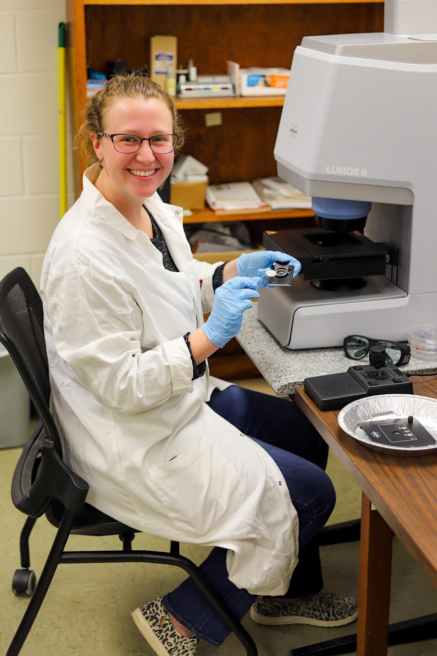 Caroline Hitchcock, Tennessee Tech graduate student, places a sample filter onto the FT-IR microscope provided by Tech's Water Center.