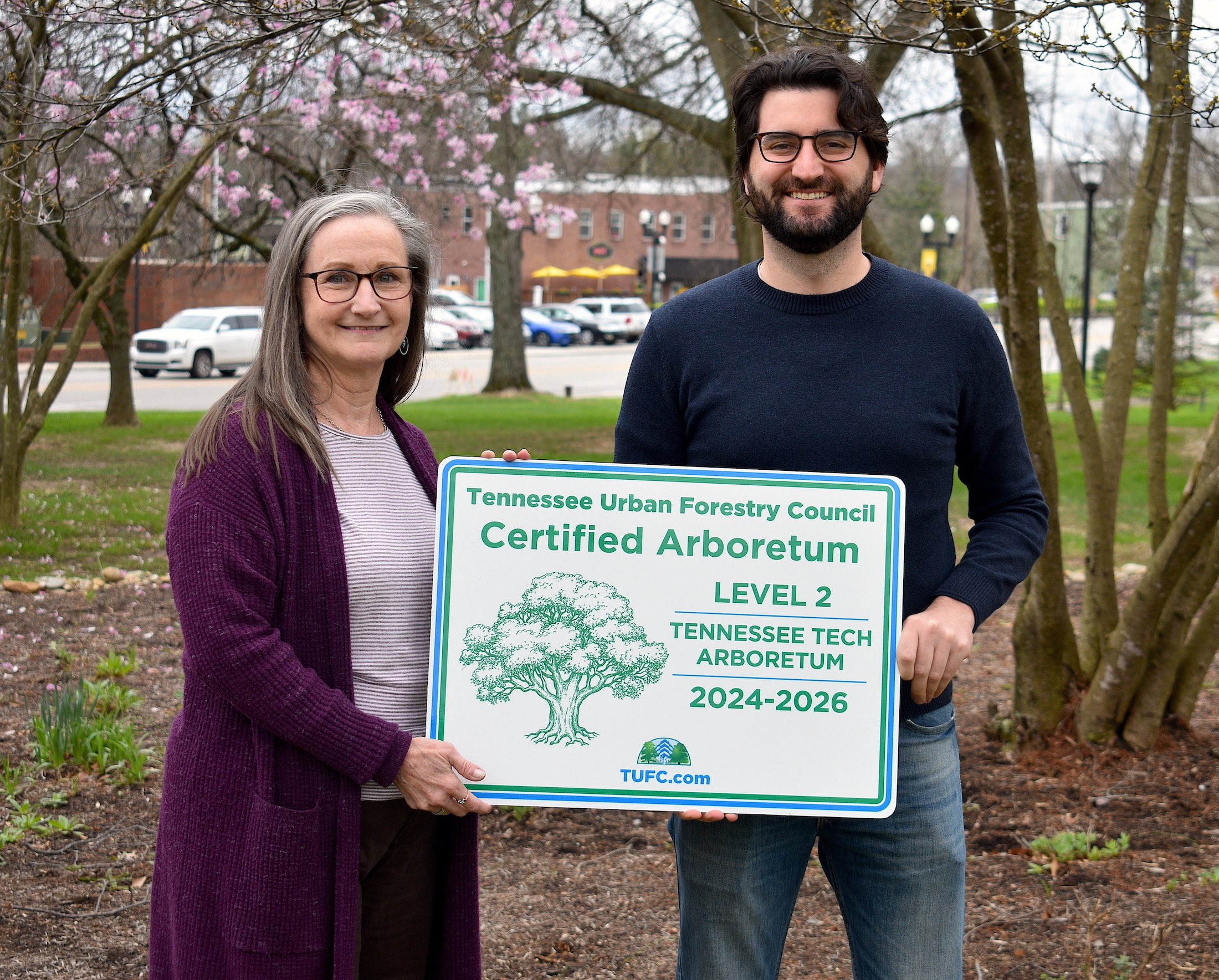 From left: Delayne Miller, sustainability manager at Tech, is presented with the university’s official arboretum certification by Kevin Bolger, council operations and program coordinator for the Tennessee Urban Forestry Council. 
