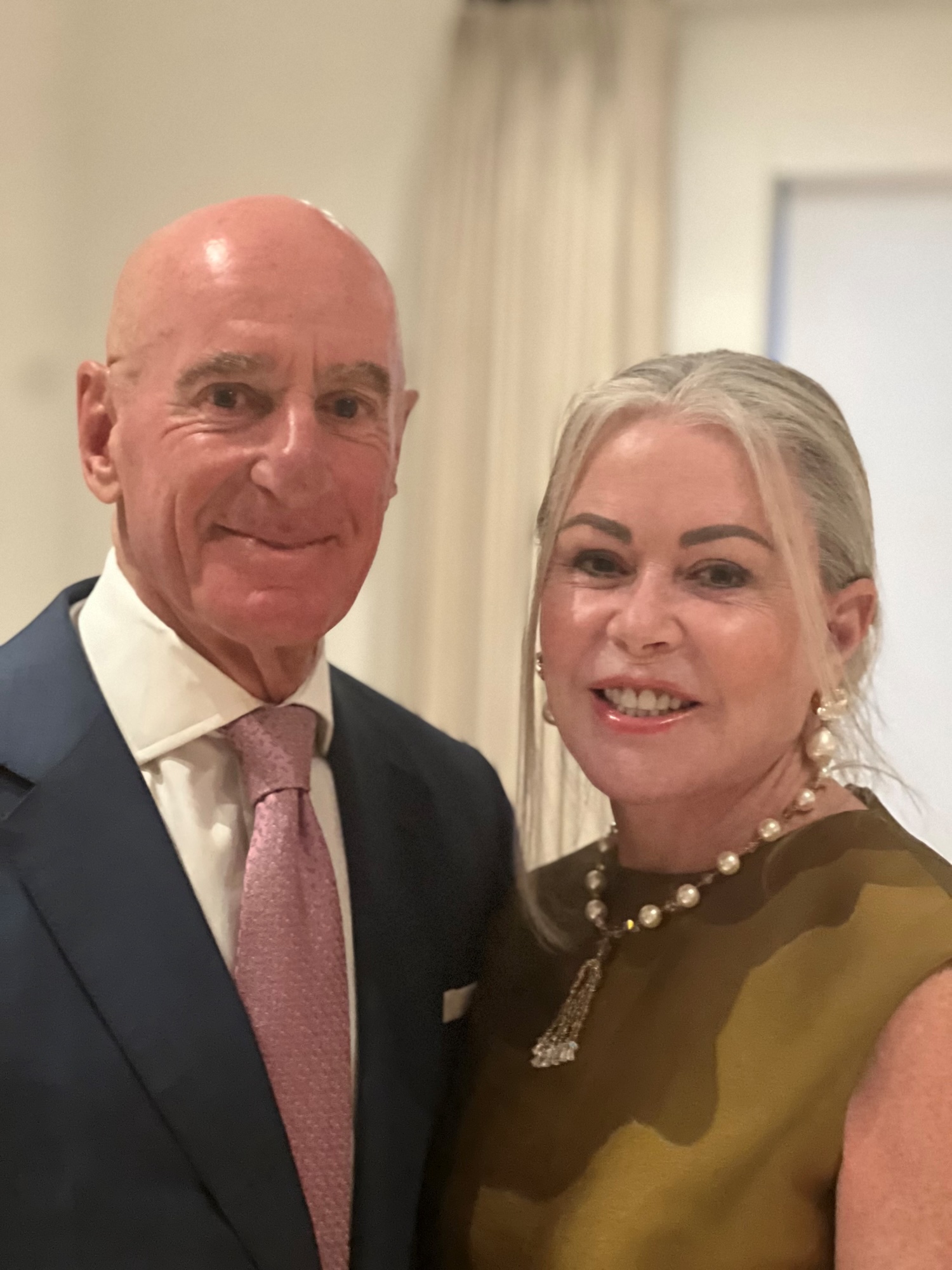 Photo of Tom and Judith Iovino smiling in semi-formal attire.