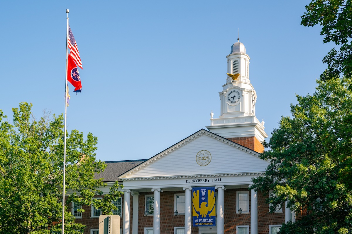 The front of a building is shown with signage saying "#1 public university in TN" 