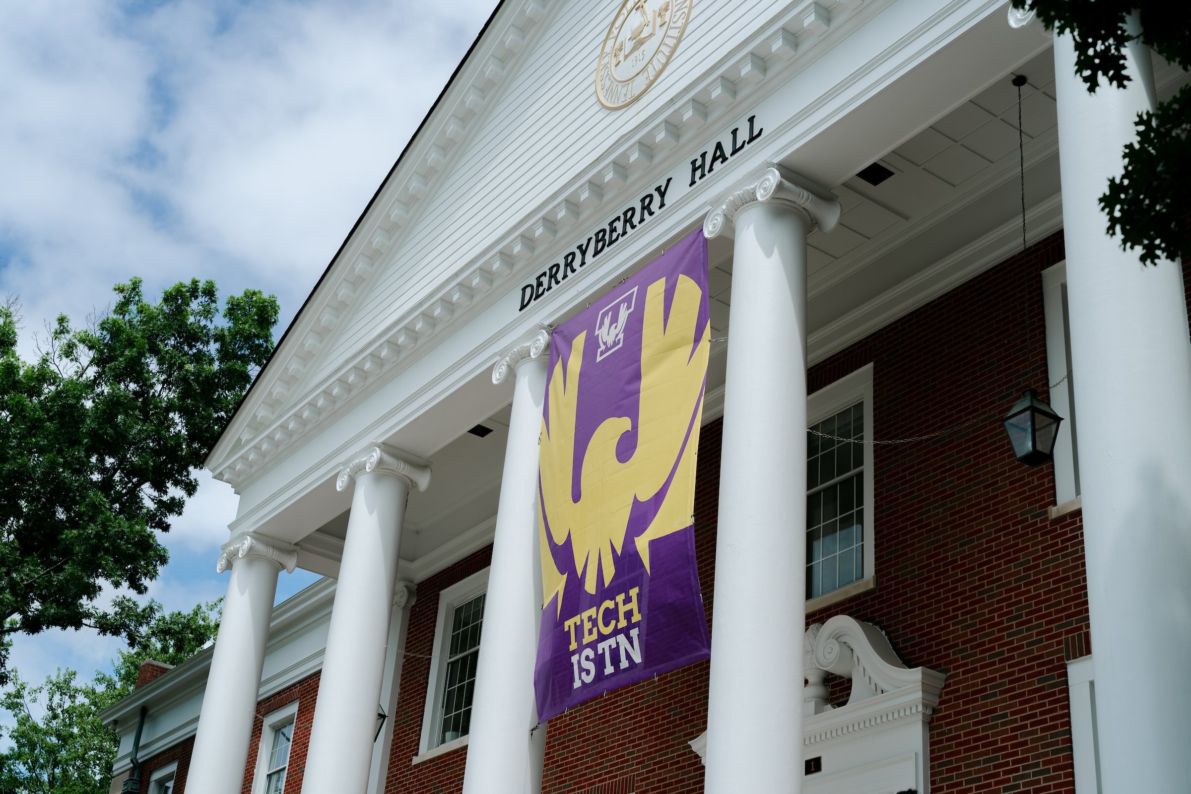 The front of Derryberry Hall is shown with a banner that reads "Tech is TN." 