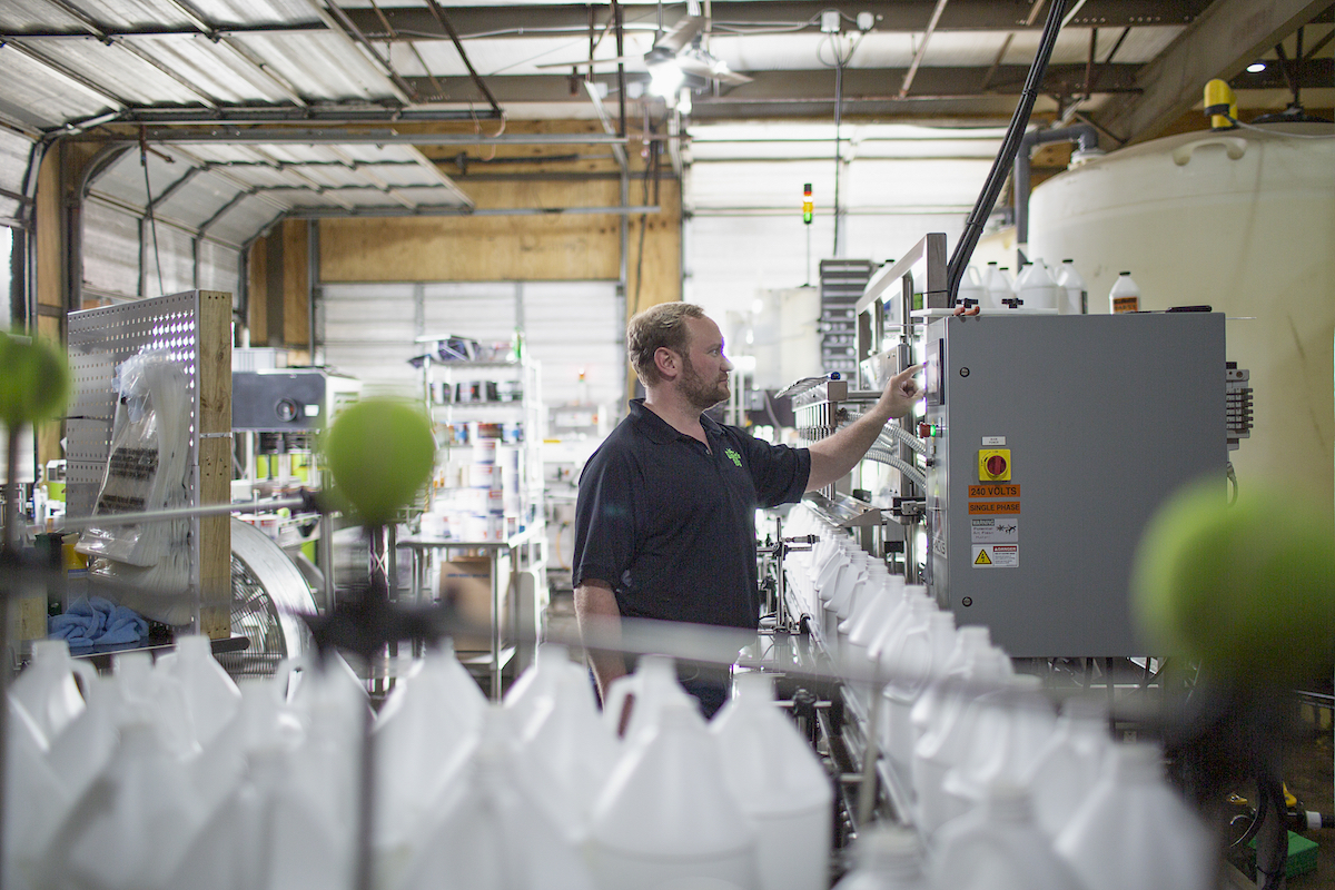 Froggy's Fog CEO Adam Pogue works behind the scenes developing hand sanitizer in his Columbia, Tennessee, facility.