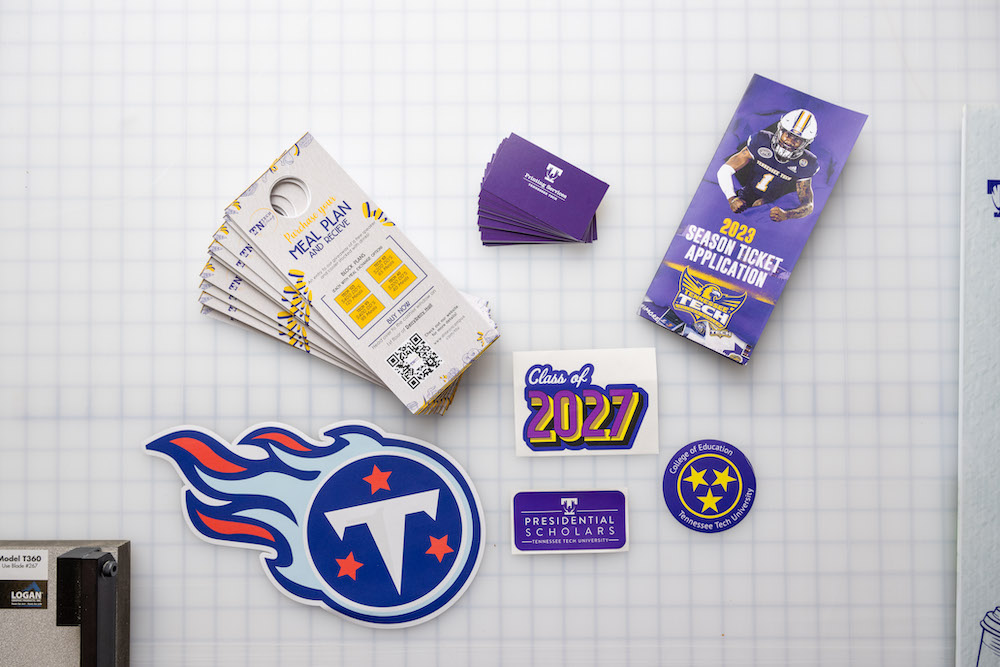 an assortment of Tennessee Tech and Tennessee Titan stickers laid on a table