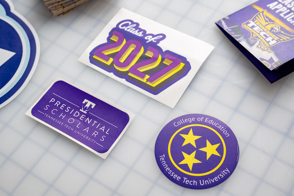 an assortment of Tennessee Tech stickers displayed on table