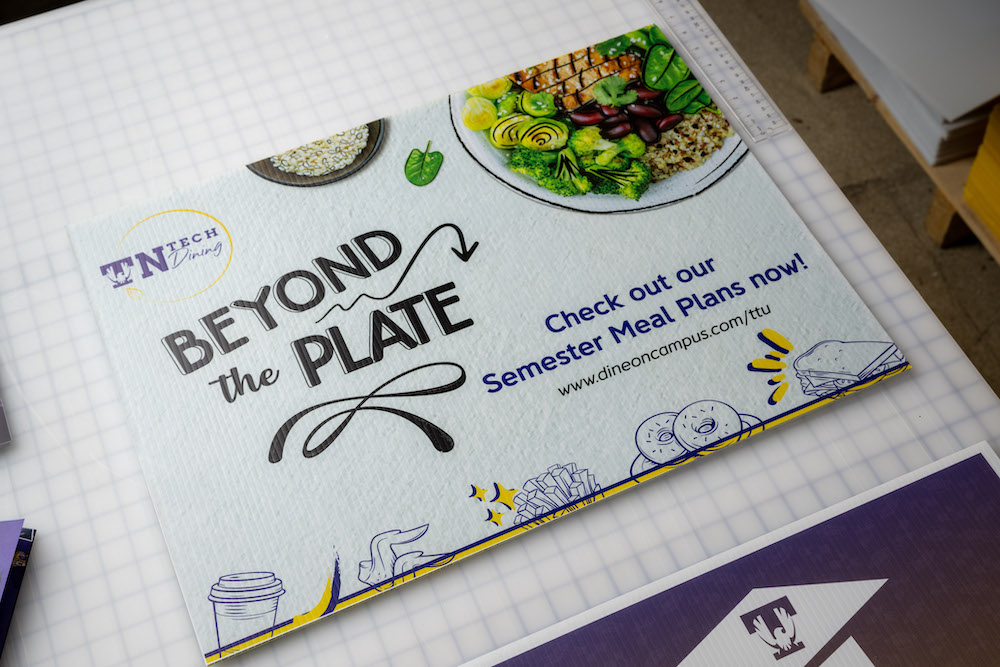 flyer that says "Beyond the Plate Check out our semester meal plans now!" laid on a table