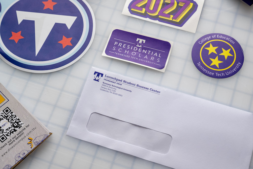 an assortment of sticker and envelopes display on table