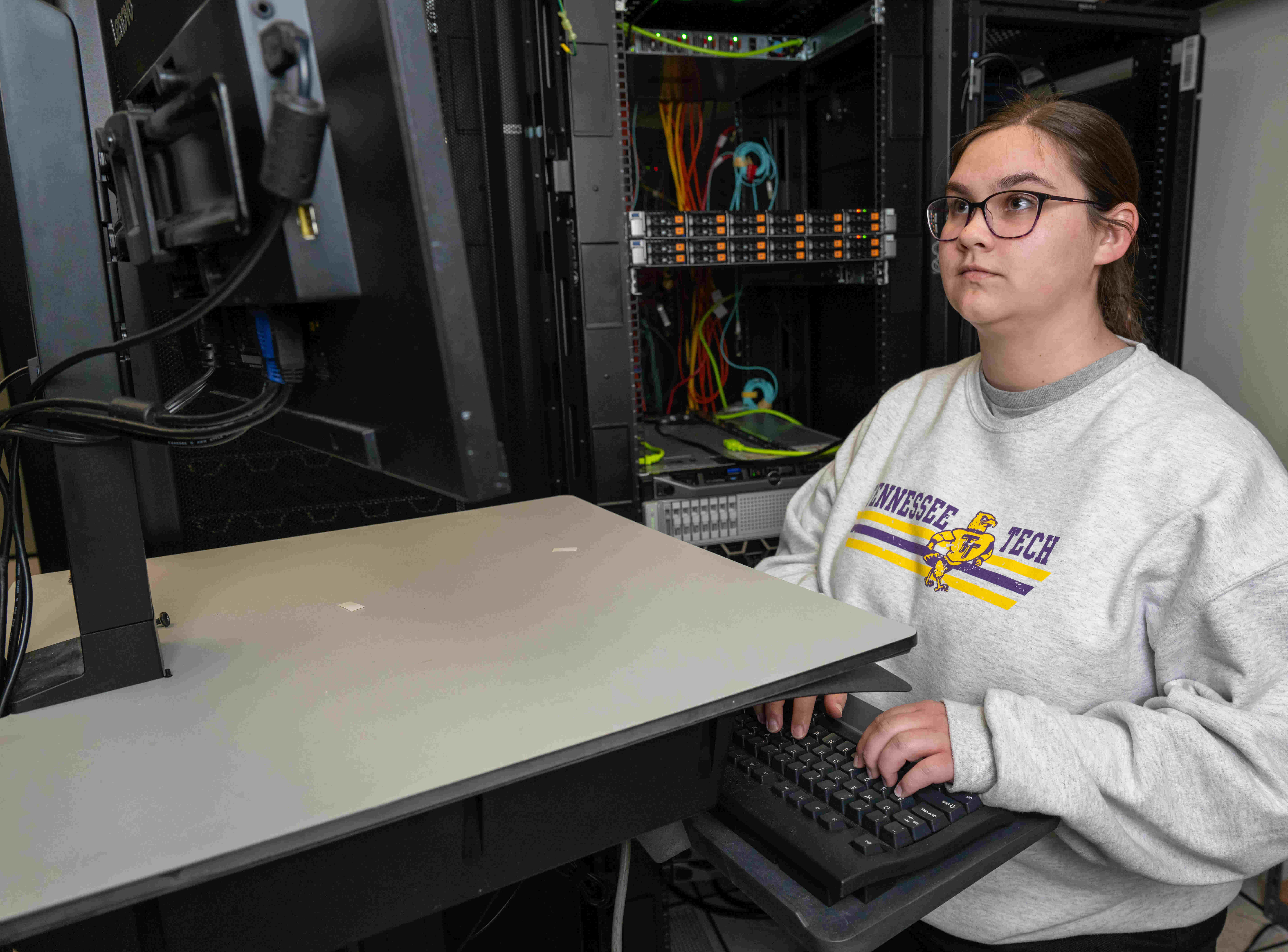 Olivia Henry working in Tech's server room