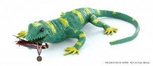 plastic lizard with a cockroach wearing a medal in it's mouth