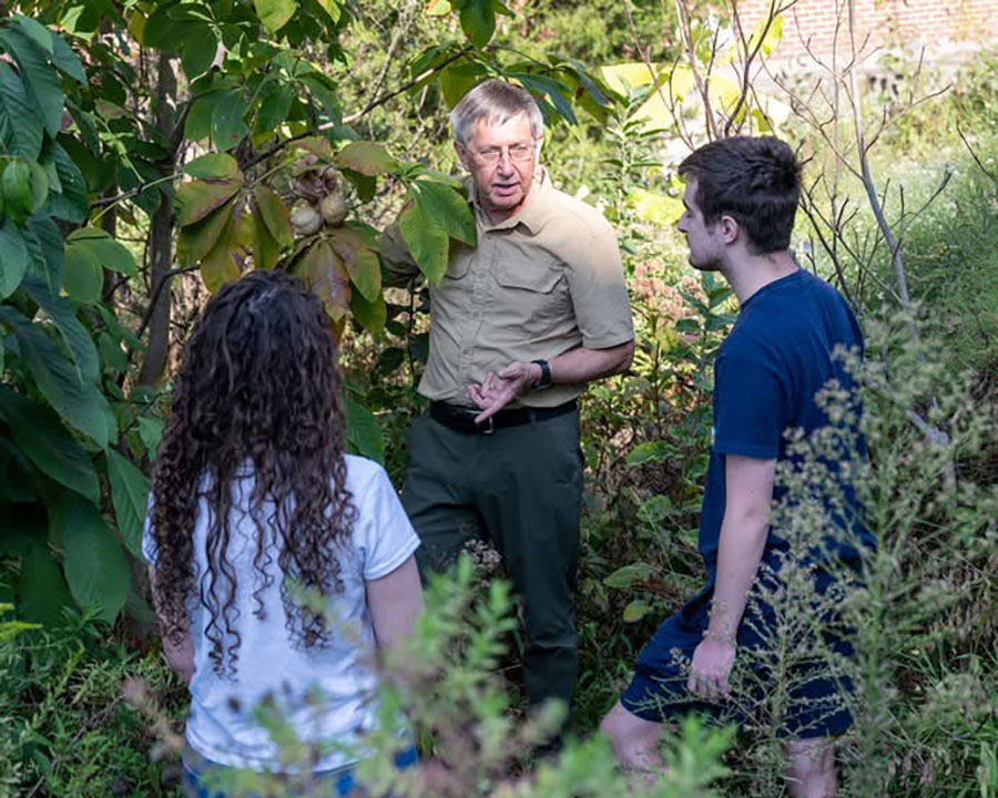 Dr. Daniel Combs leads a field-based biology lesson with Tennessee Tech students in a natural outdoor setting.
