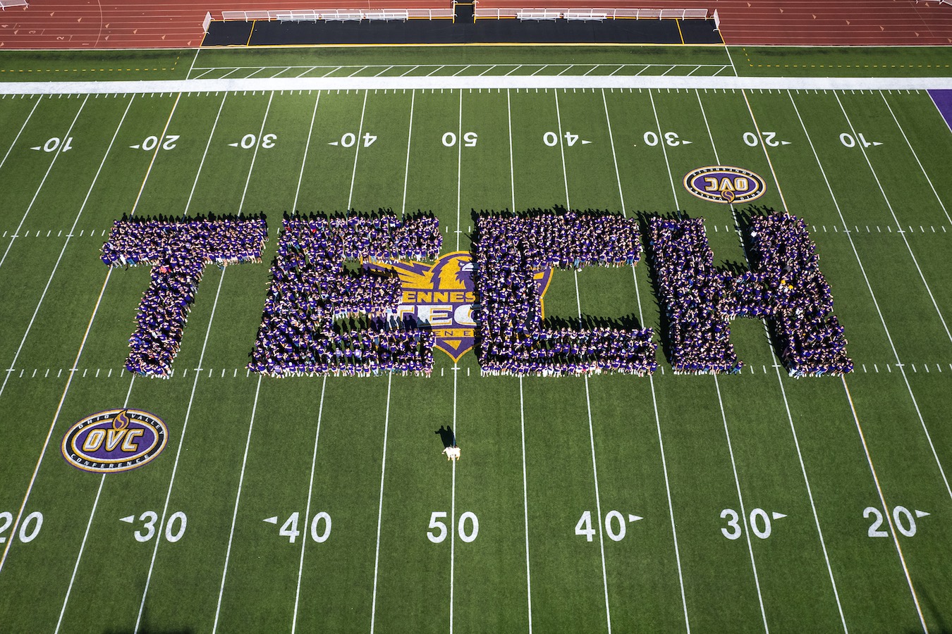 aerial photo of students forming the word TECH on Overall Field