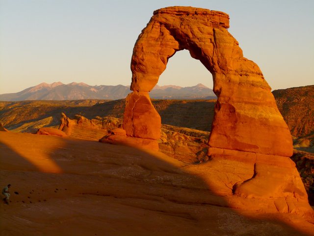 A photo of a sandstone arch in Arches National Park.